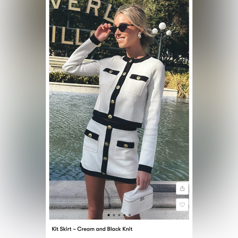 Show Me Your MuMu Cream and Black Mini Skirt with Gold Accents.Looks like Chanel